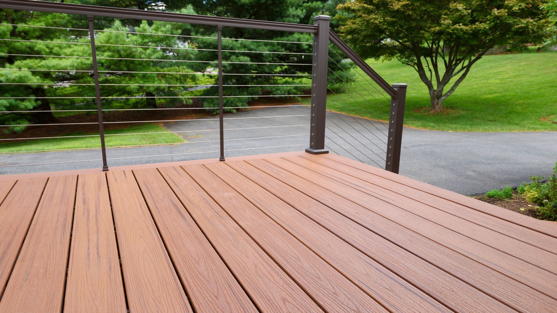 New deck with metal railing overlooking a lush landscape in Gilbert, AZ.