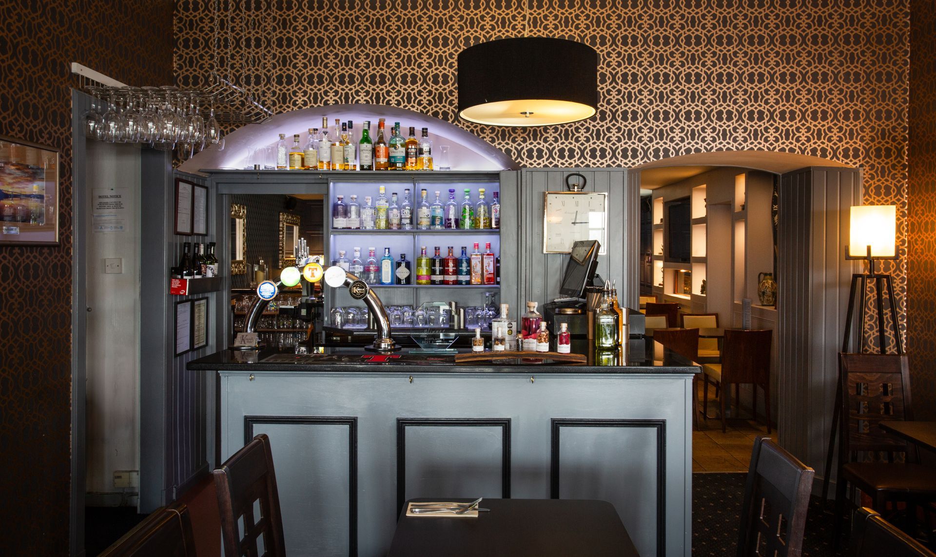 A bar with a lot of bottles on it