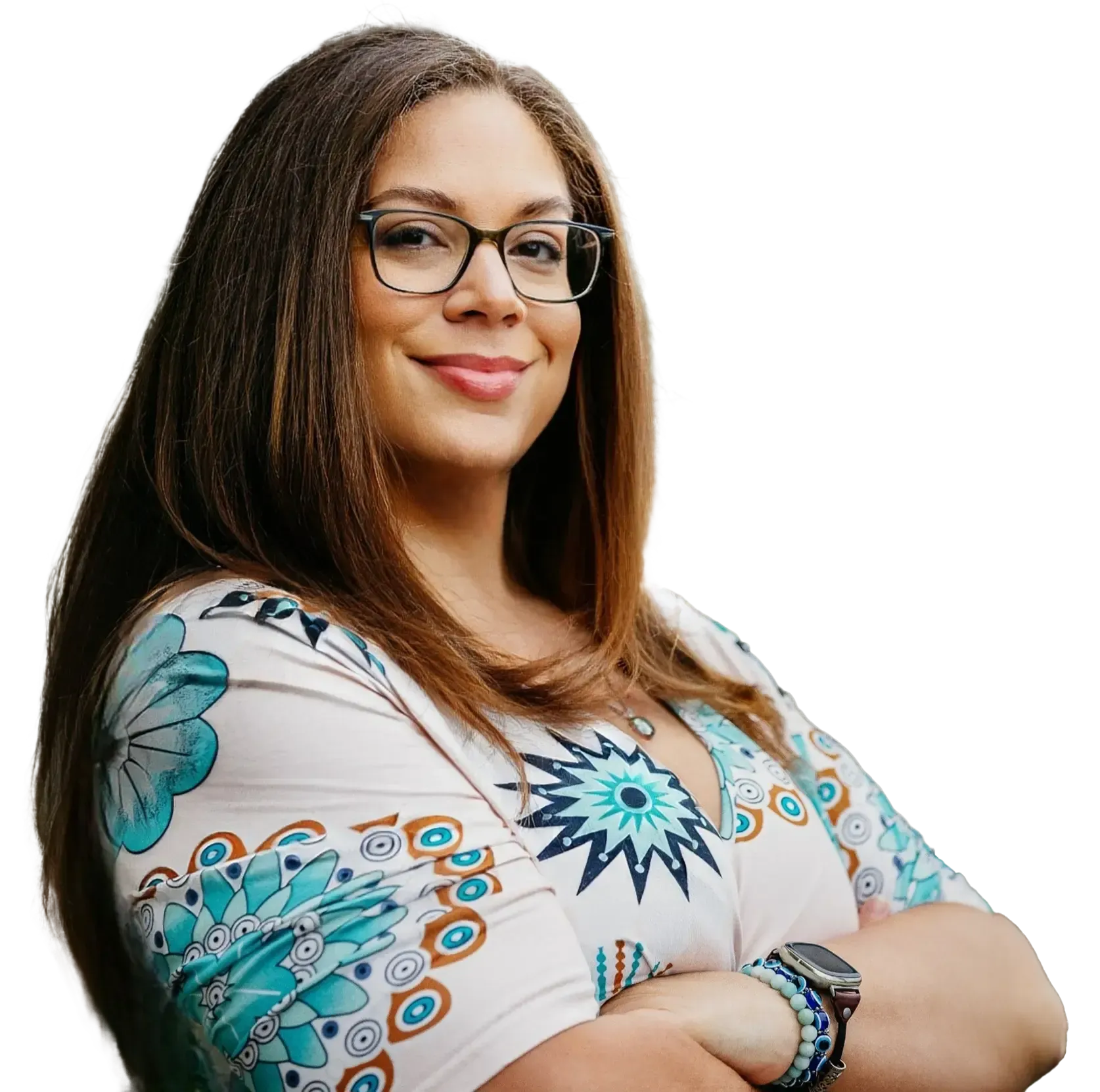A woman wearing glasses and a watch is smiling with her arms crossed