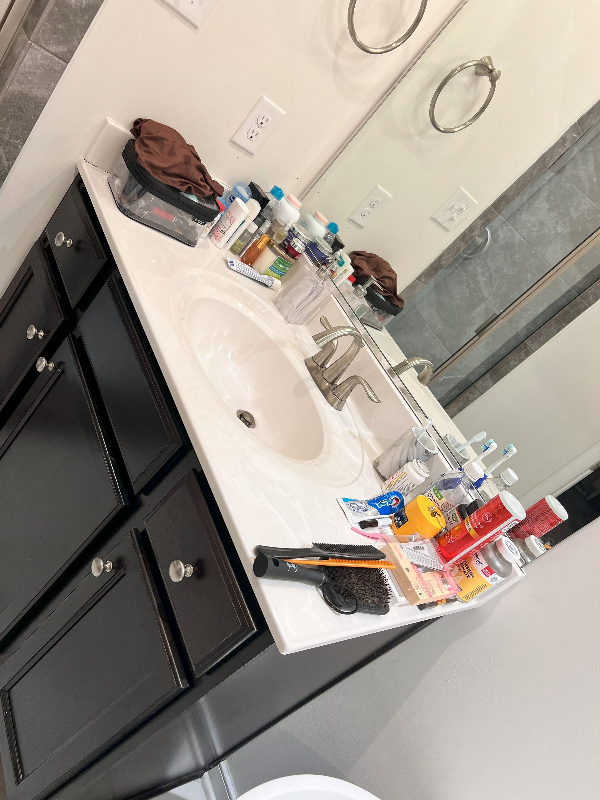 A bathroom with a sink , mirror and toilet.