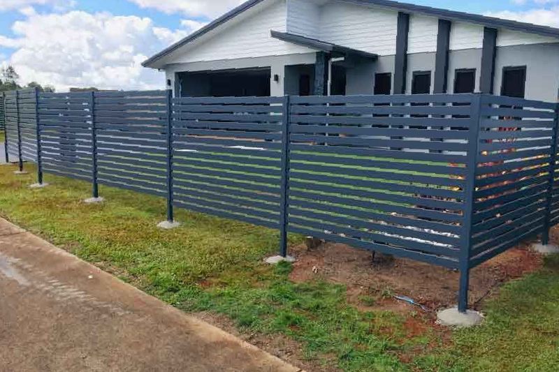 A Close Up of a Wooden Fence With a Black Frame — Fencing Around In Mareeba, QLD