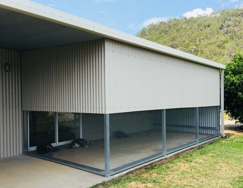 A Building With a Screened in Porch and a Large Window — Fencing Around In Mareeba, QLD