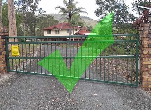 A Green Gate With an Arrow Pointing to a House — Fencing Around In Mareeba, QLD