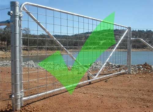 A Fence With a Green Arrow Pointing to a Lake — Fencing Around In Mareeba, QLD