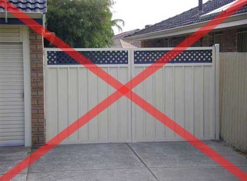A White Gate is Crossed Out With a Red Line — Fencing Around In Mareeba, QLD