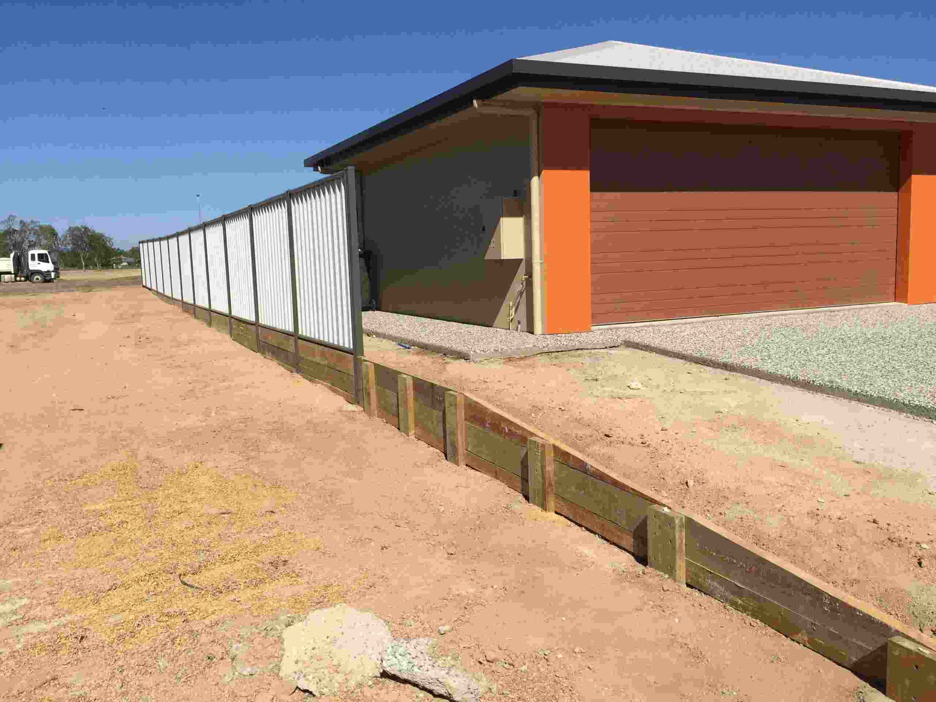 A Fence is Being Built in Front of a House — Fencing Around In Mareeba, QLD