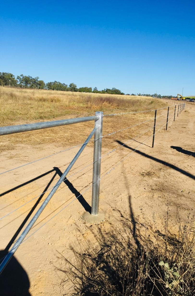 A Dirt Road With a Fence in the Foreground — Fencing Around In Mareeba, QLD