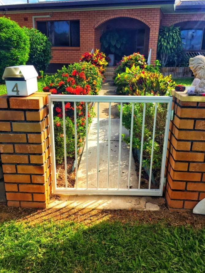A White Gate With the Number 4 on It — Fencing Around In Mareeba, QLD