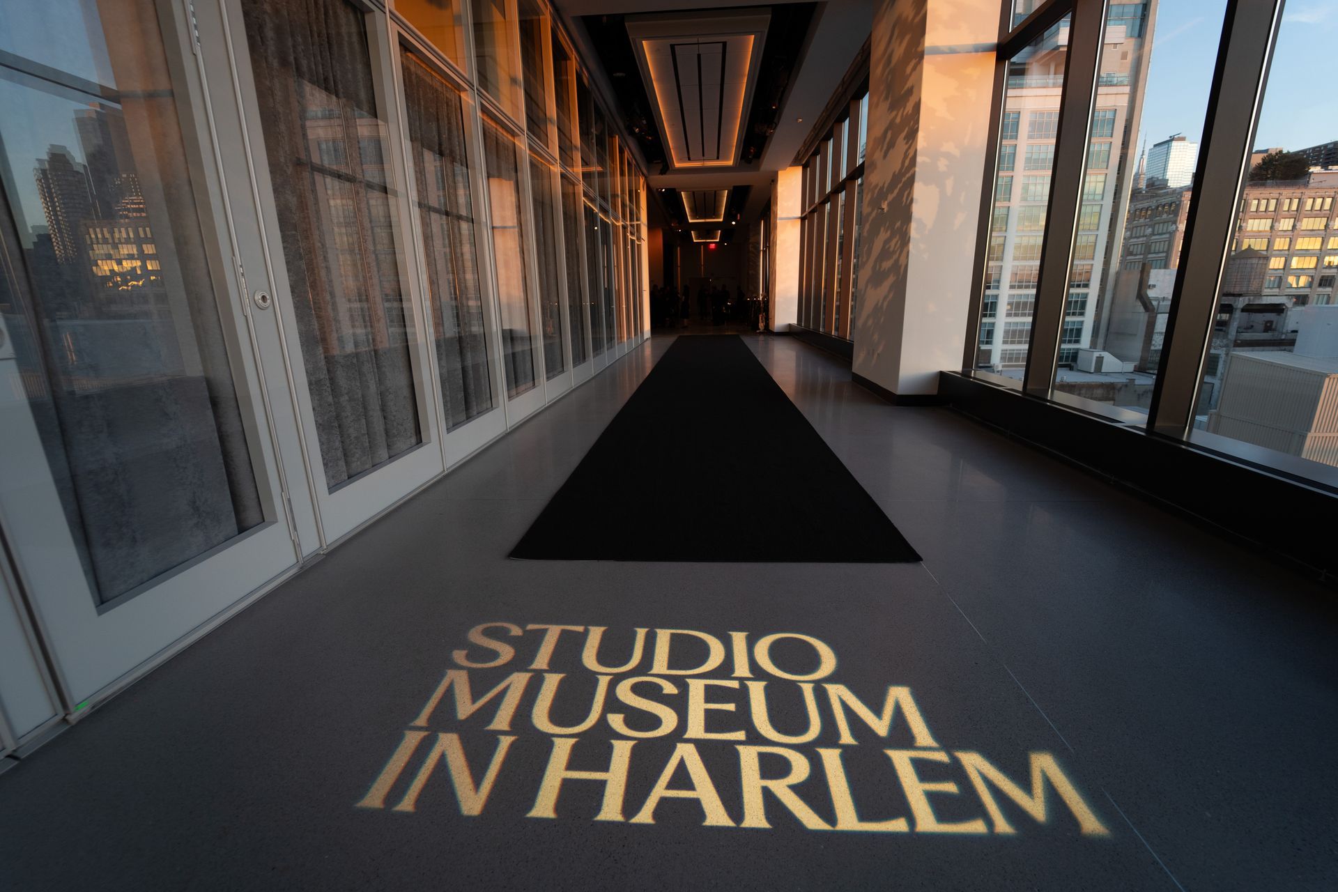 A hallway with the words studio museum in harlem on the floor