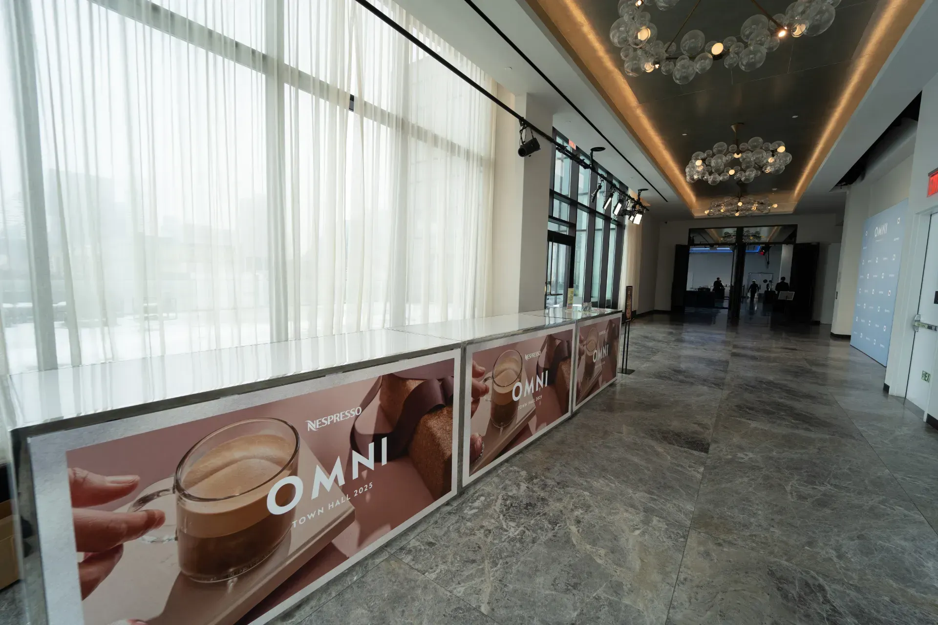 A long hallway with a sign that says omni on it
