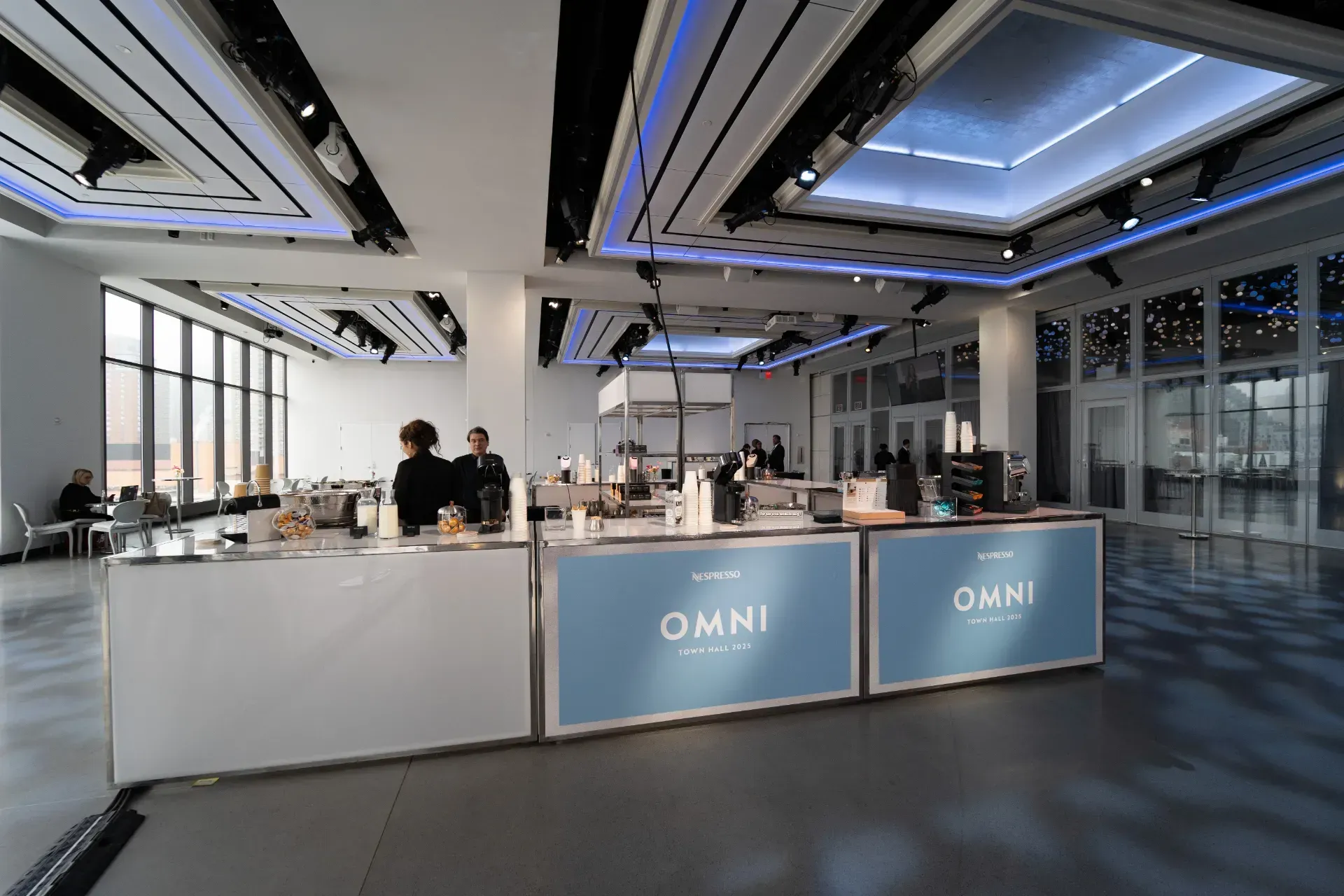 A large room with a blue sign that says omni on it.