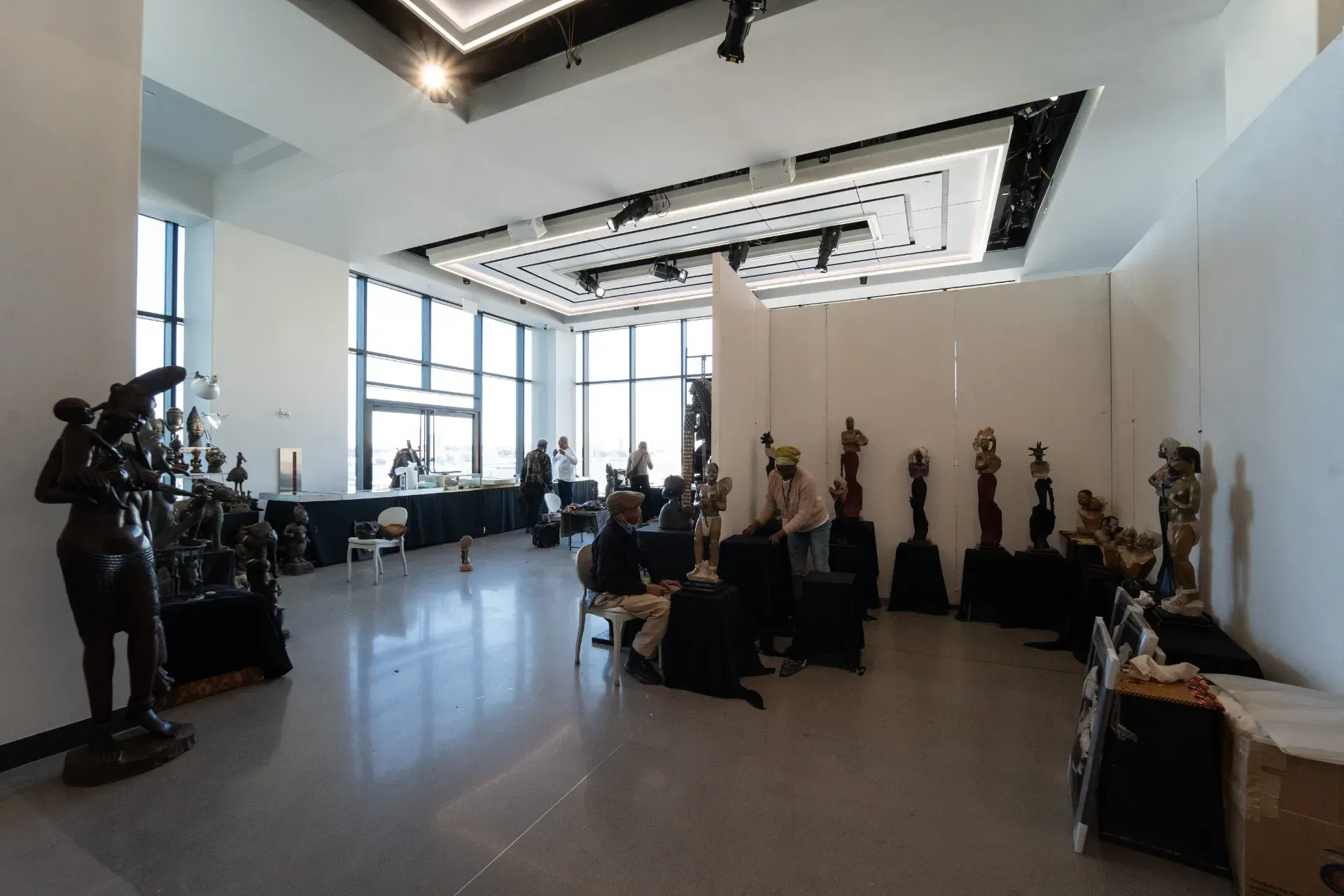 A large room with a lot of statues in it