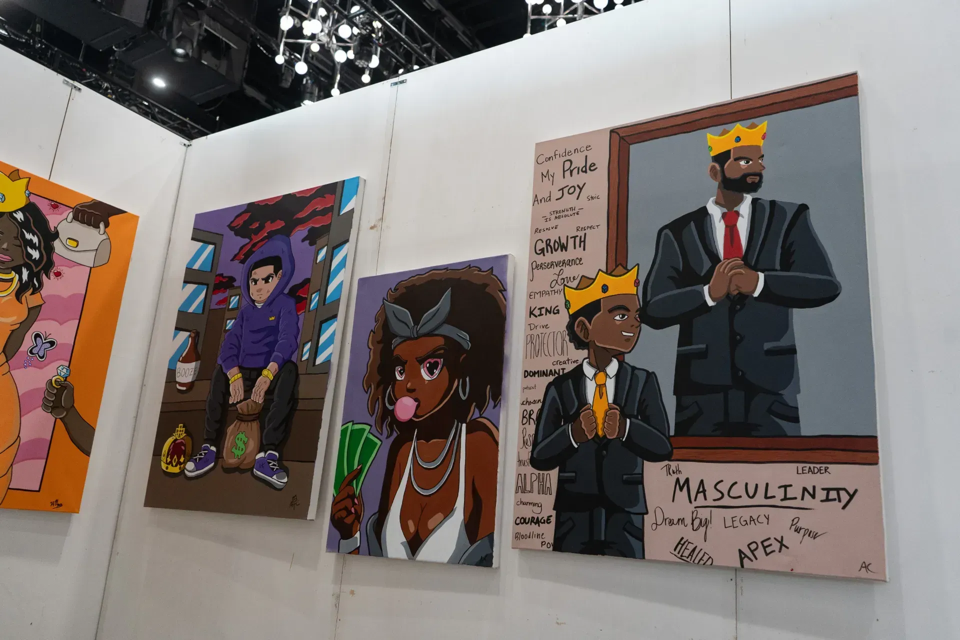 A group of paintings on a wall with one that says masculinity