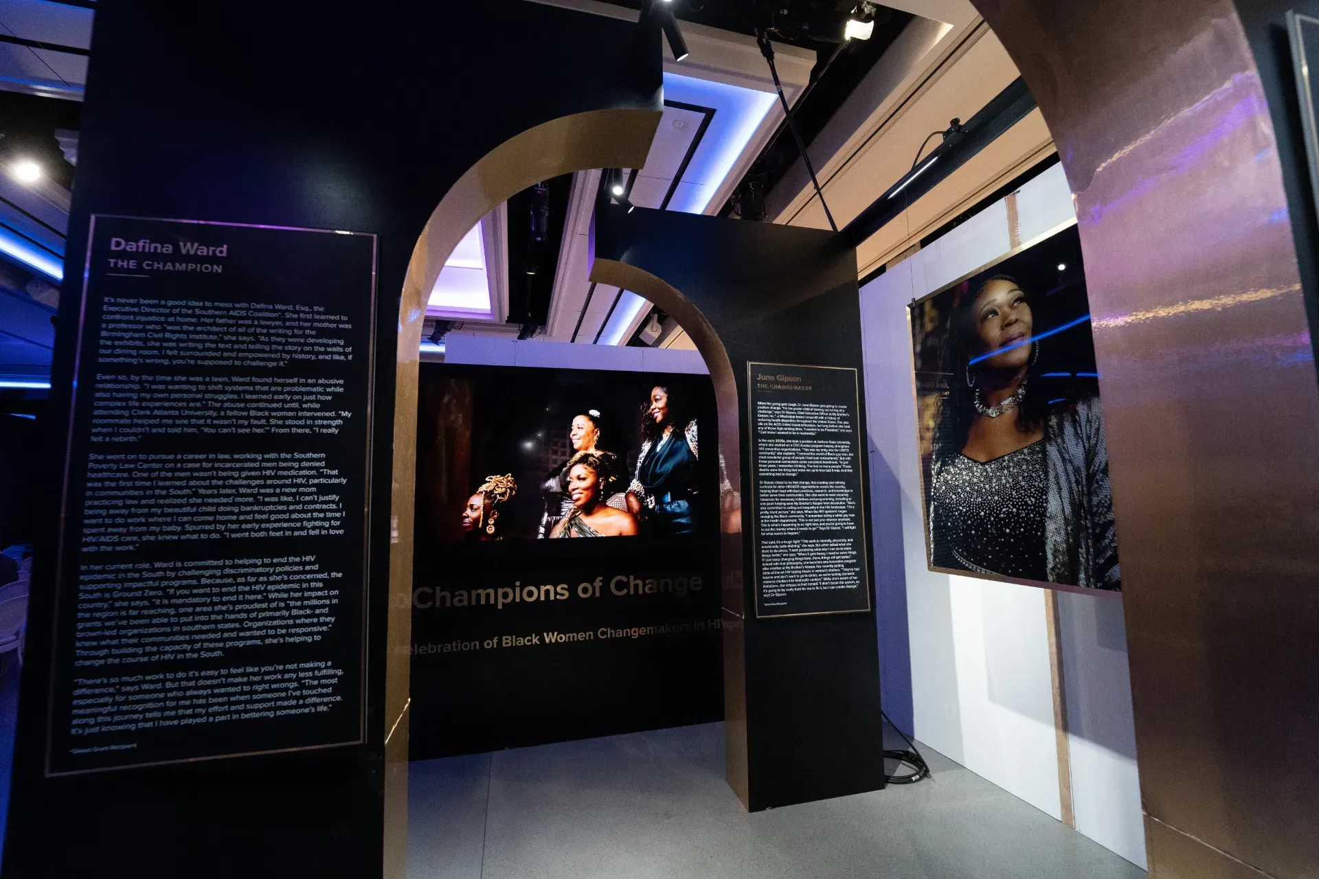 A room with a picture of a woman on the wall.