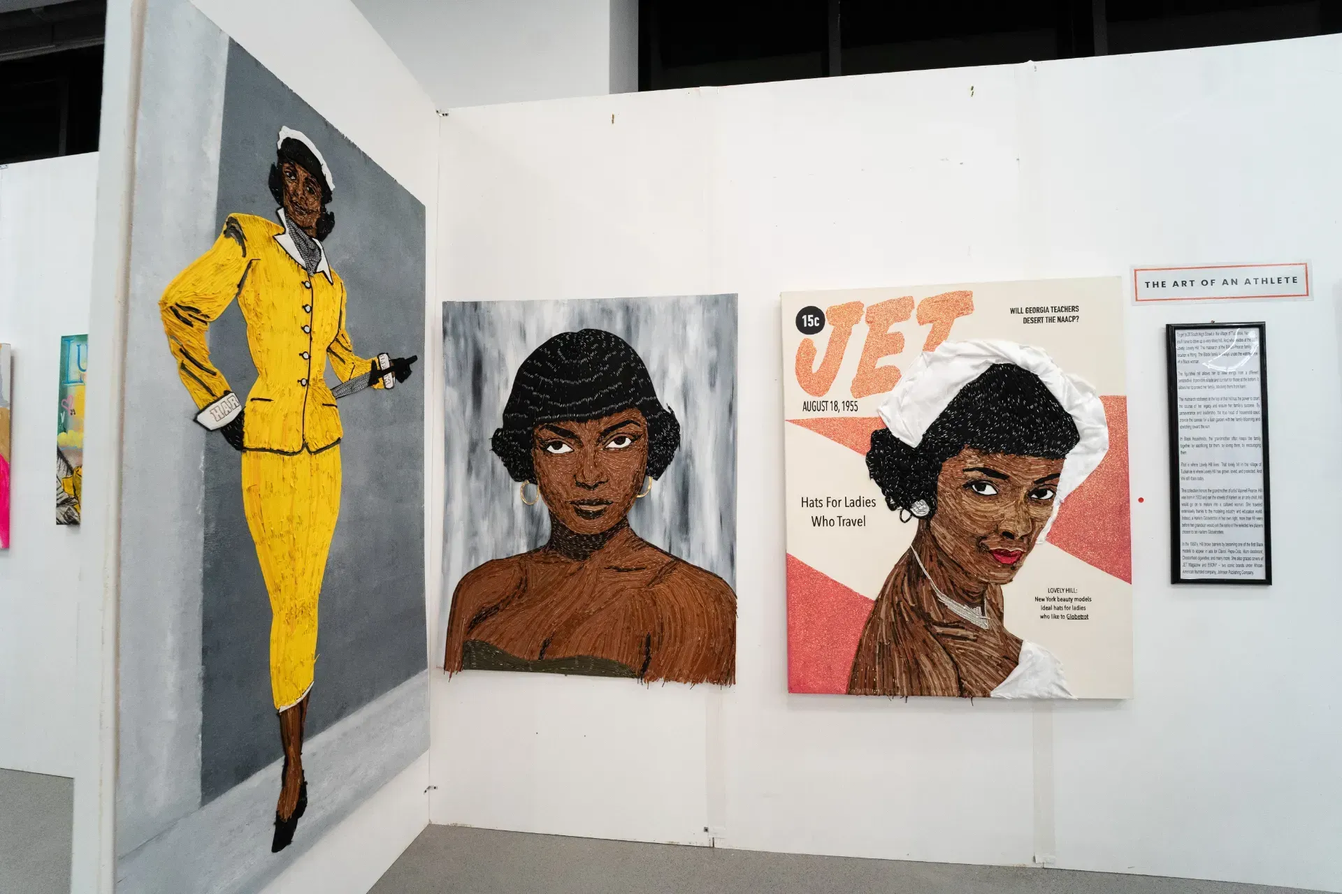 A painting of a woman in a yellow suit is hanging on a wall.