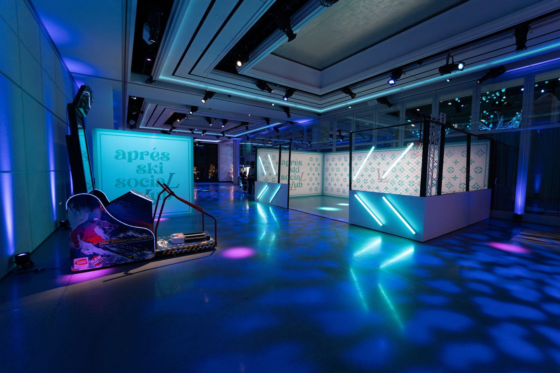 A modern venue with blue neon lights. A decorative sign reads