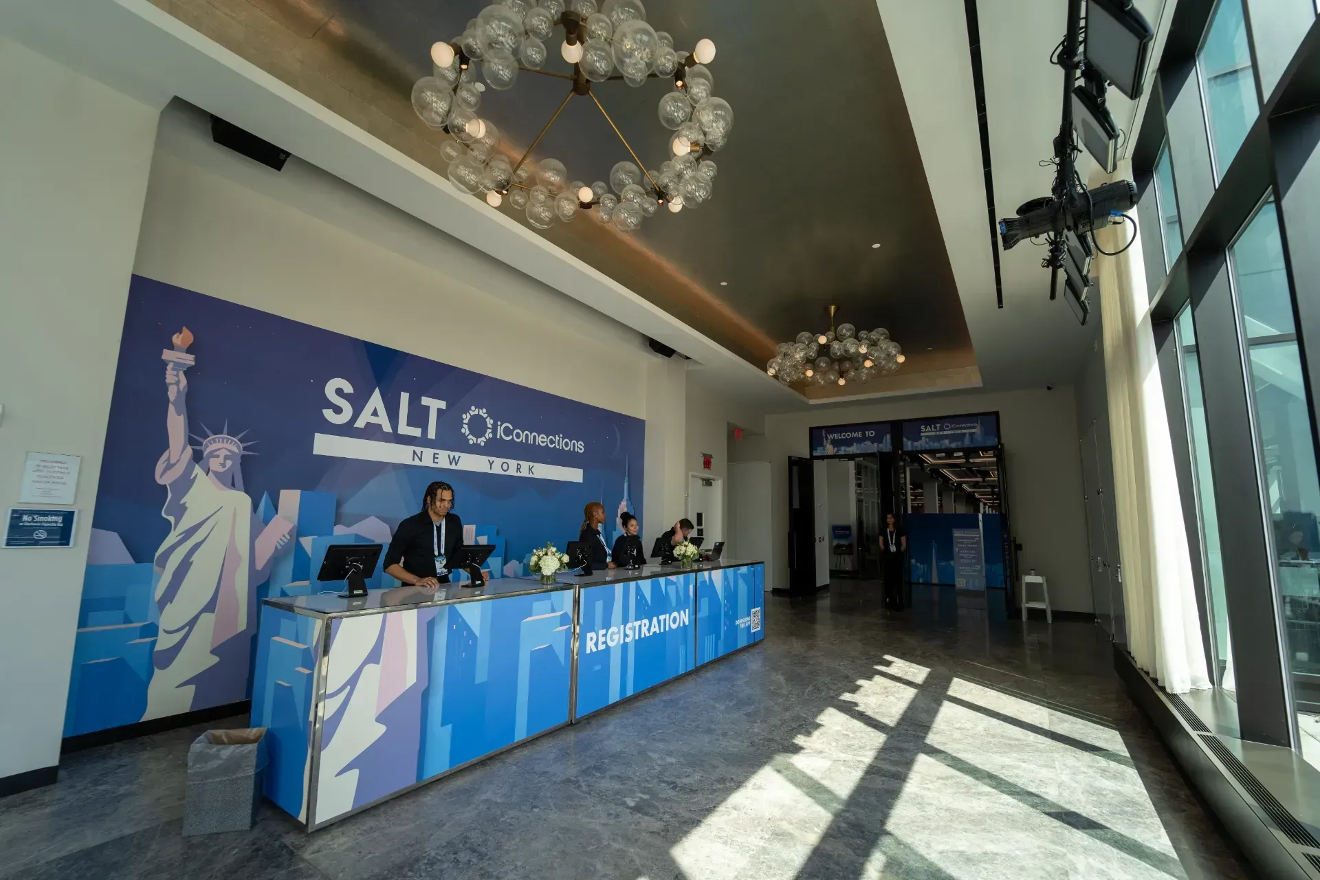 A lobby with a statue of liberty on the wall and a sign that says salt
