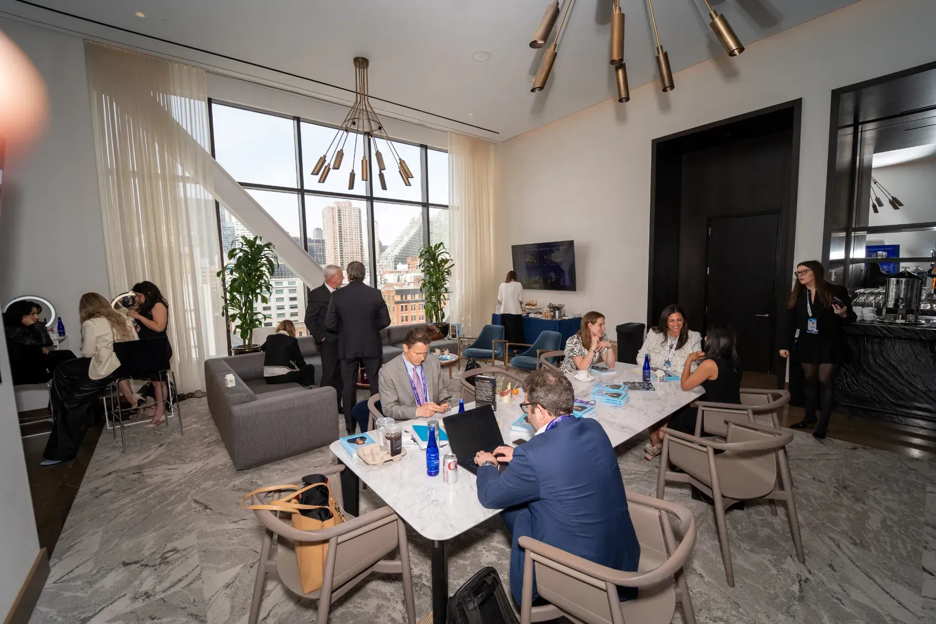 A group of people are sitting around a table in a room.