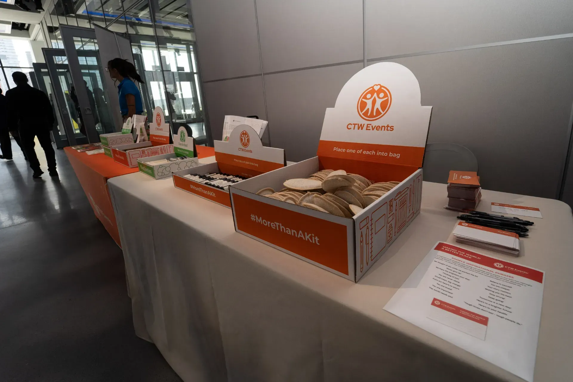 A table with boxes on it and a sign that says ' tnf foods ' on it
