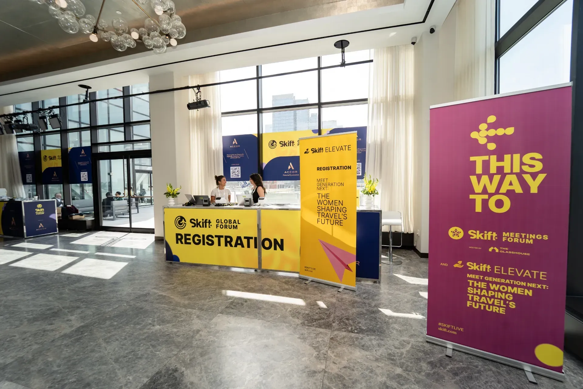 A lobby with a sign that says this way to registration