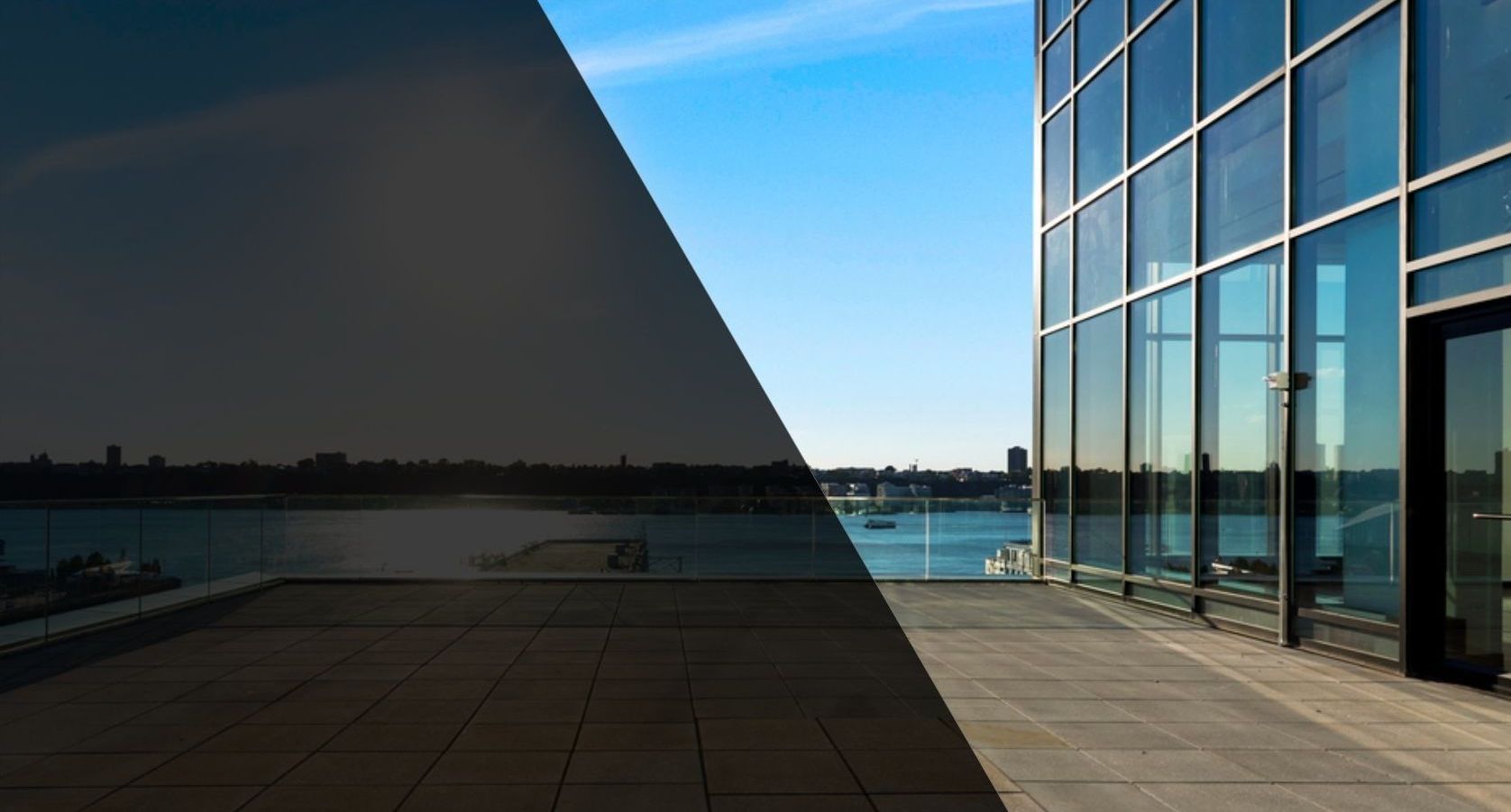 A building with a lot of windows is next to a body of water.