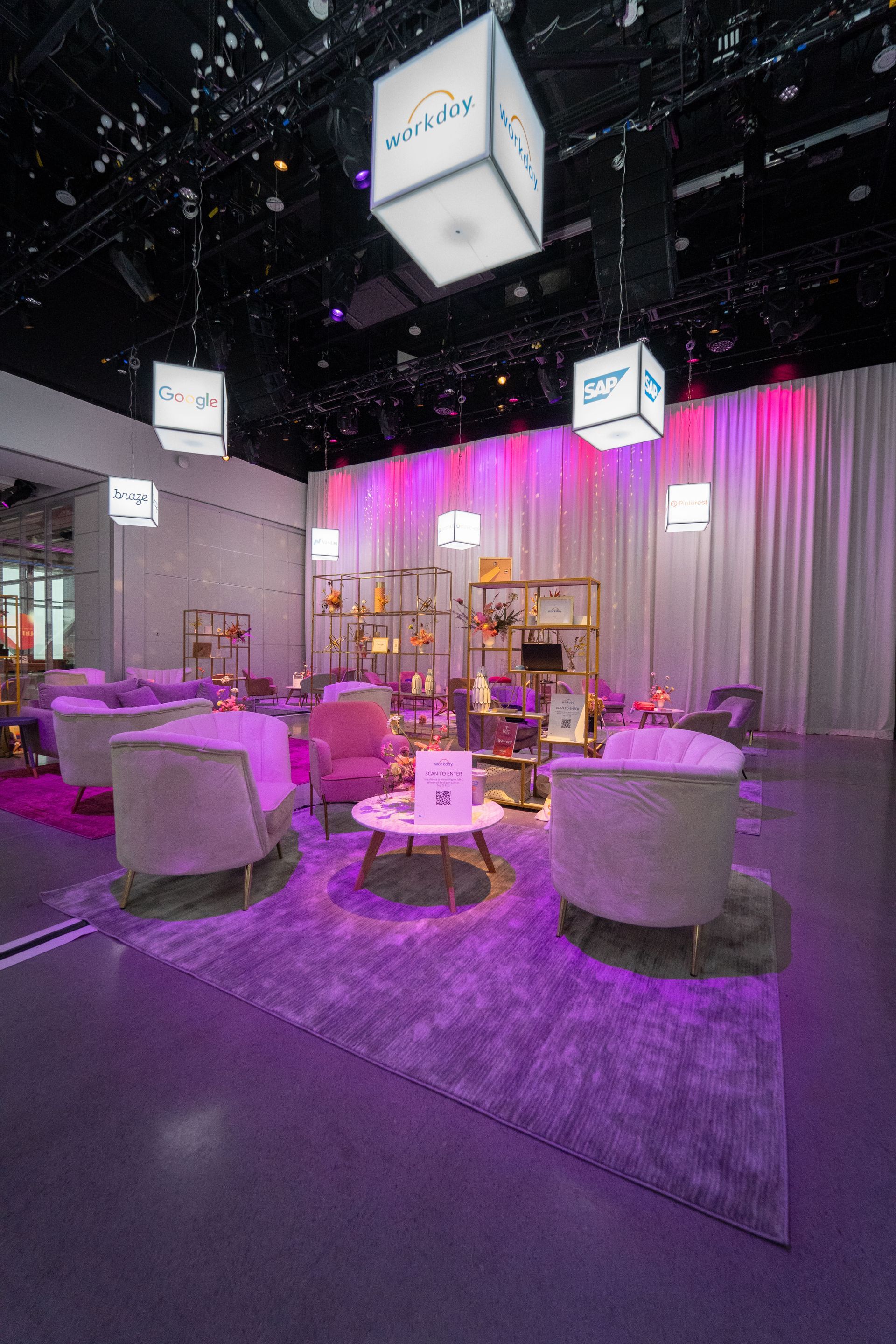 A large room filled with furniture and purple lights.