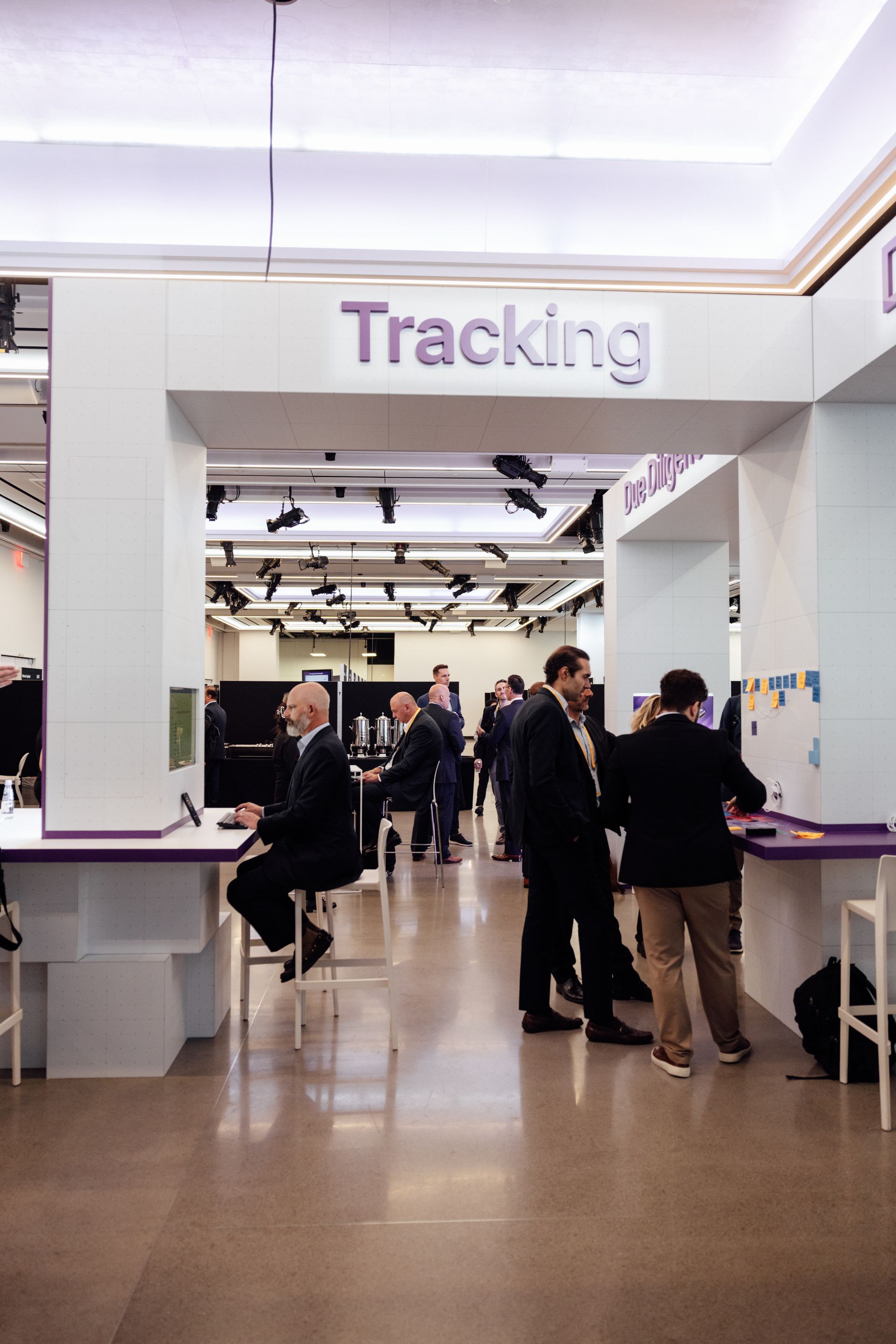 People at work desks under a 