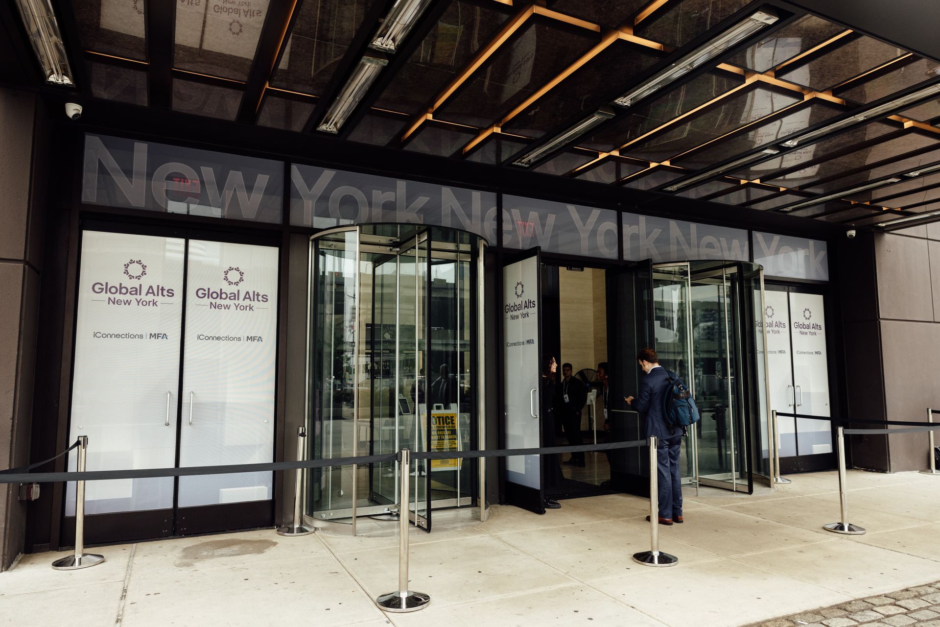 Entrance to a New York building with revolving doors; 