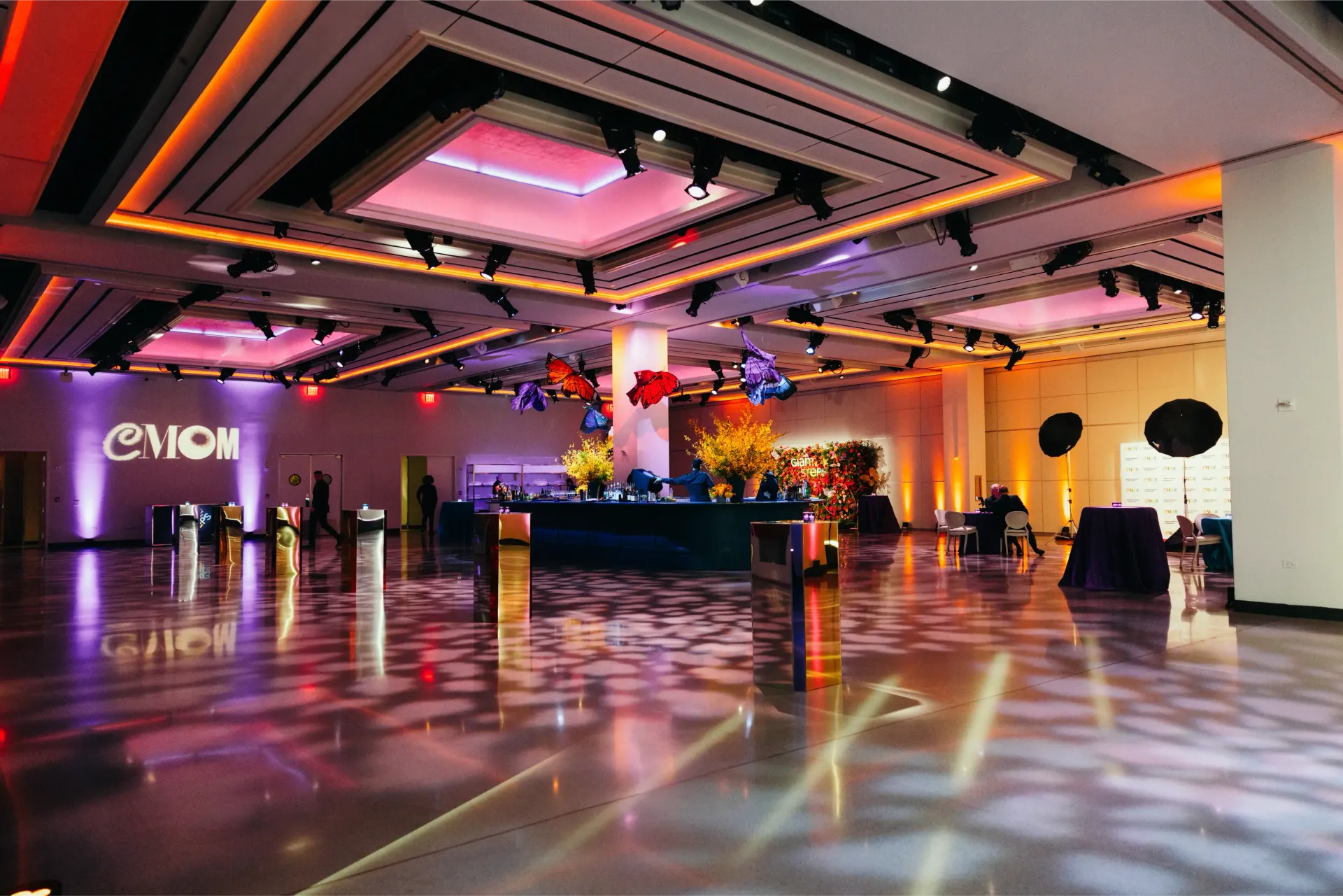 A large room with a lot of lights on the ceiling.