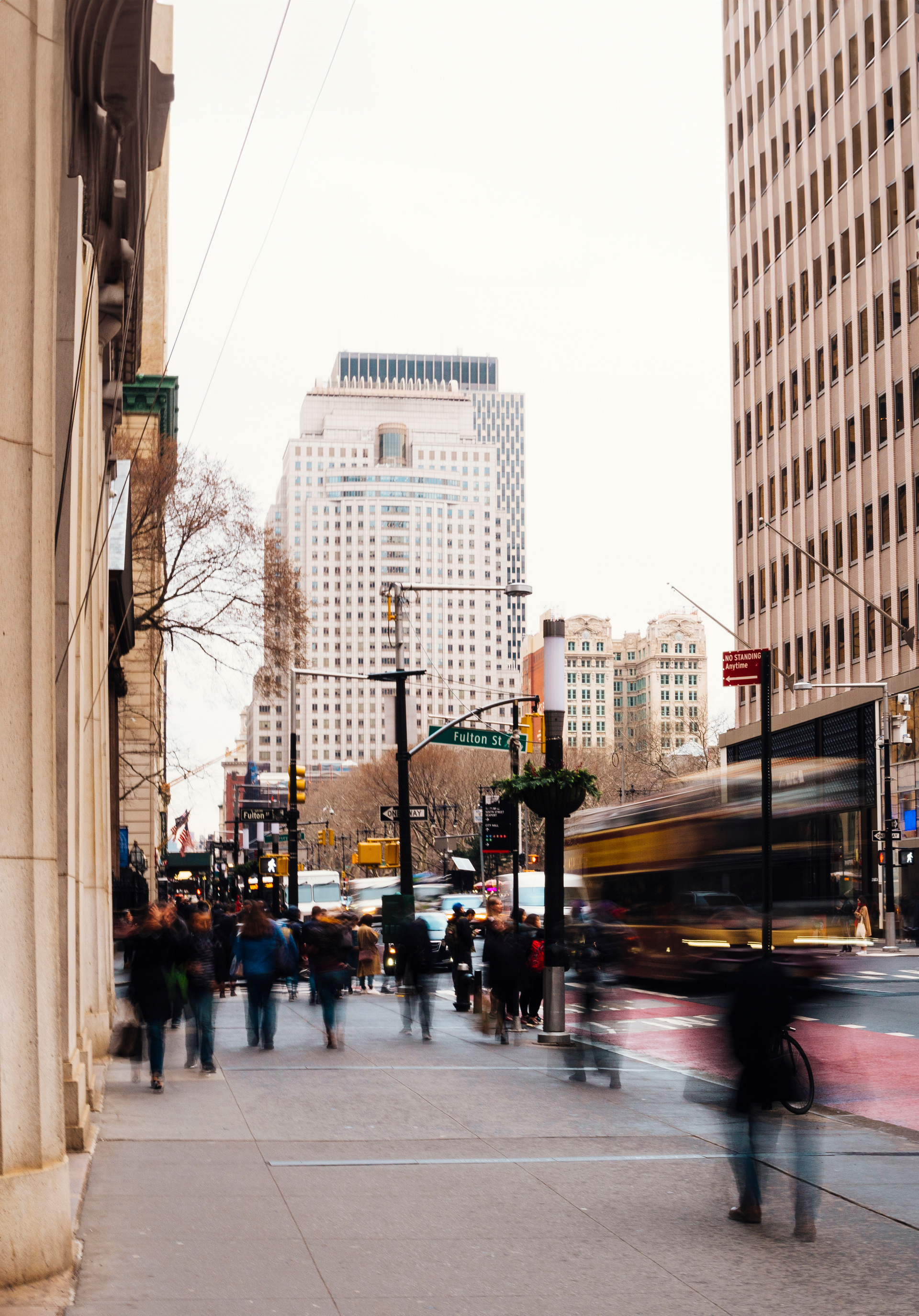 A blurry picture of people walking down a city street