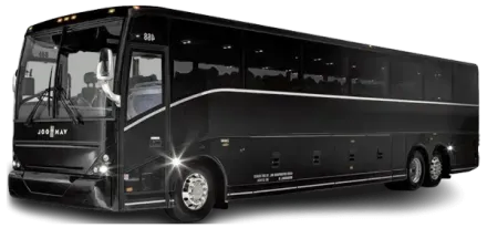 Black charter bus with silver accents parked outdoors.
