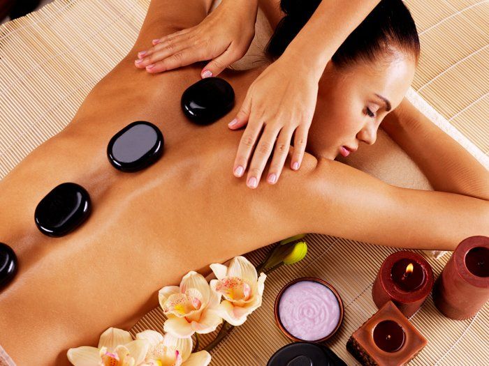 Asian Massage — Woman Having Hot Stone Massage in Delray Beach, FL