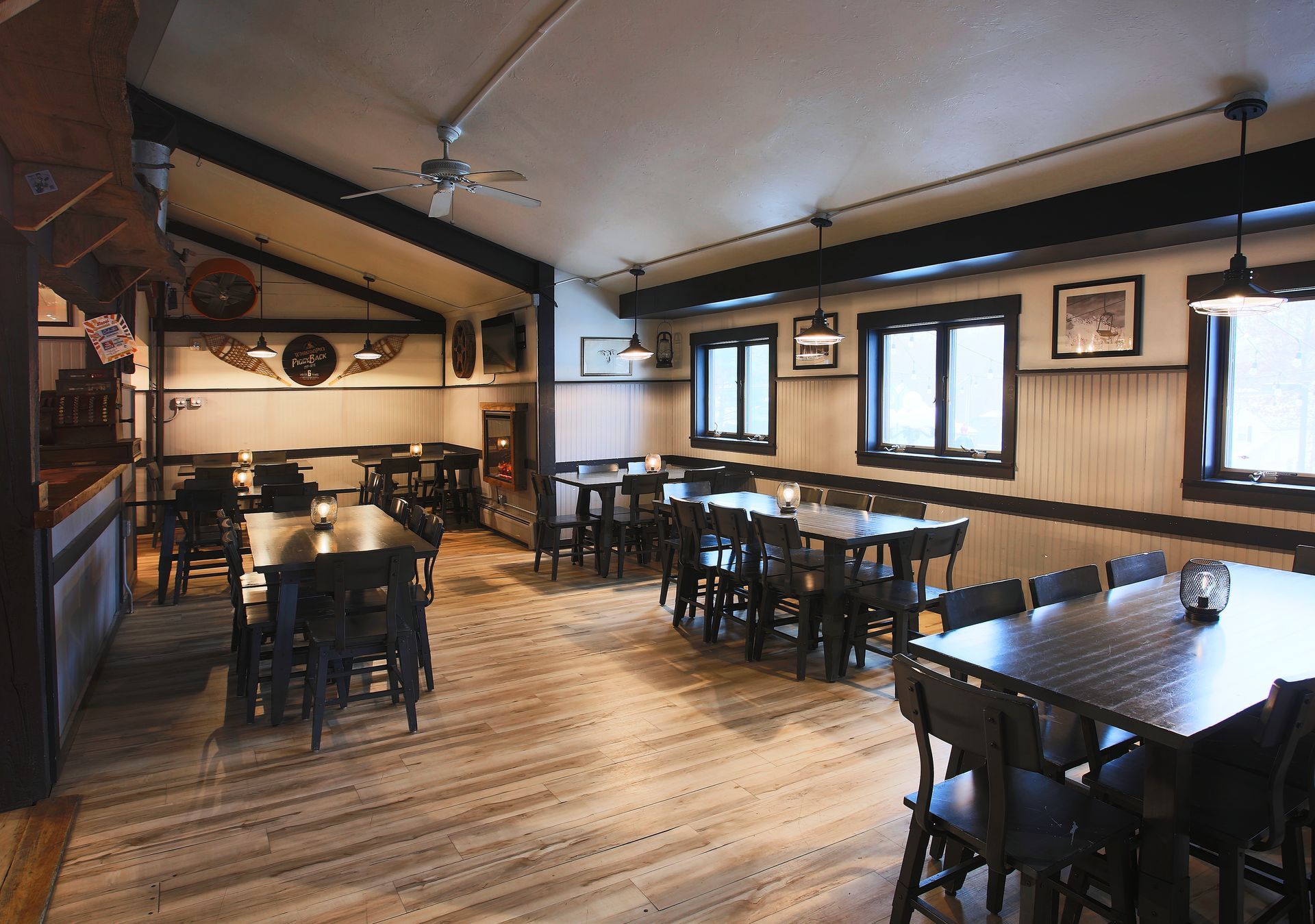 A large room with tables and chairs in it