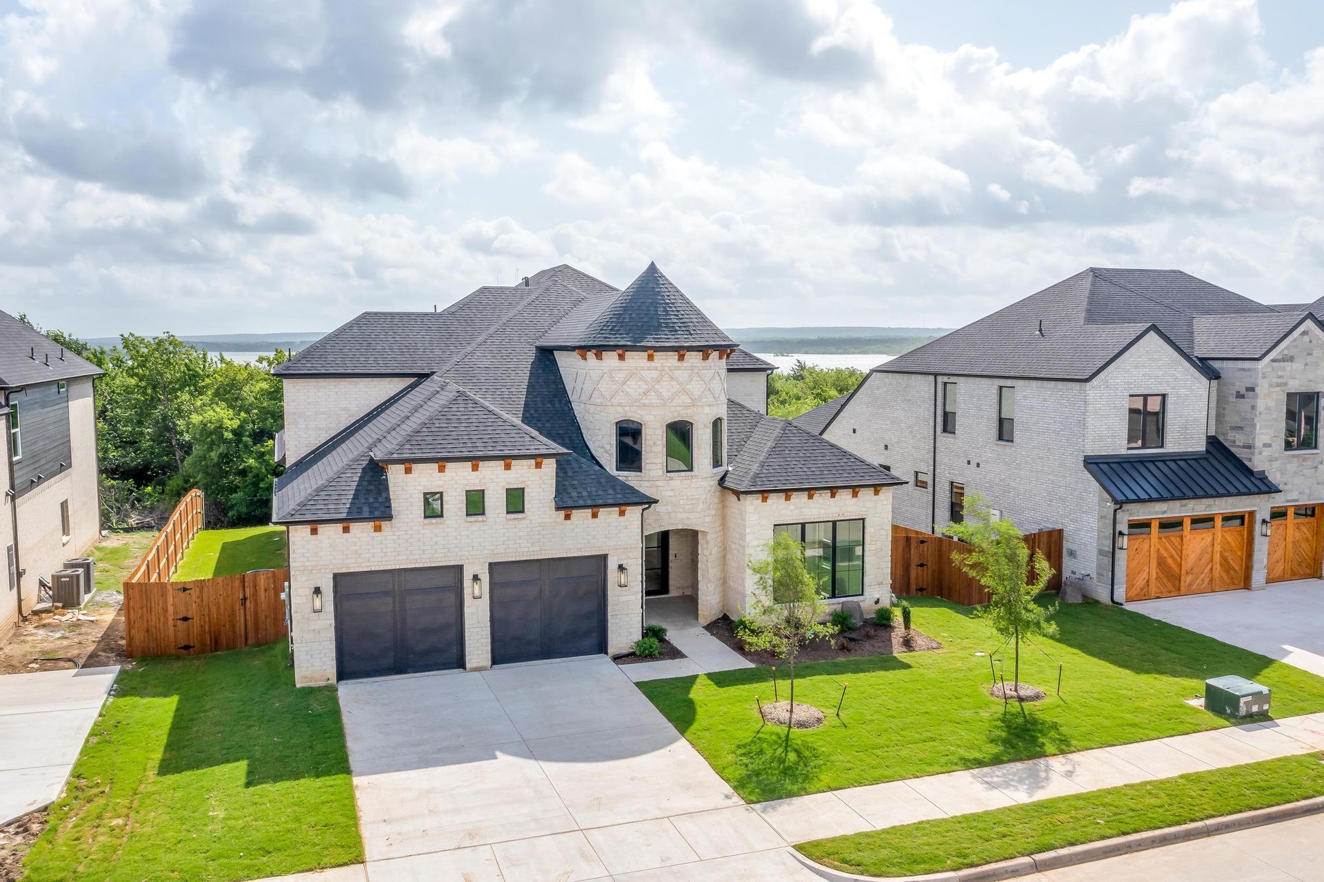 An aerial view of a large house in a residential area.