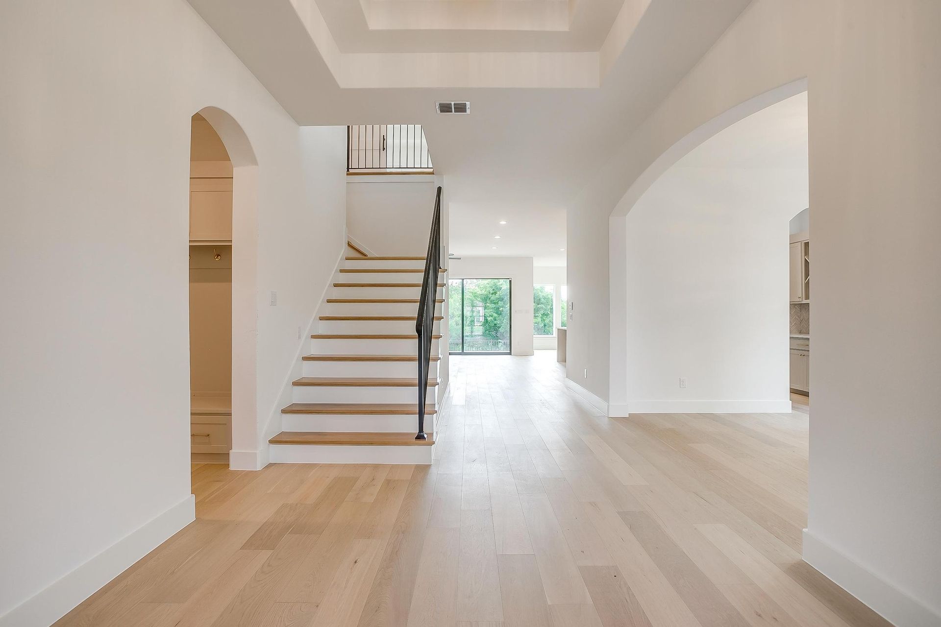 There is a staircase in the middle of the hallway.