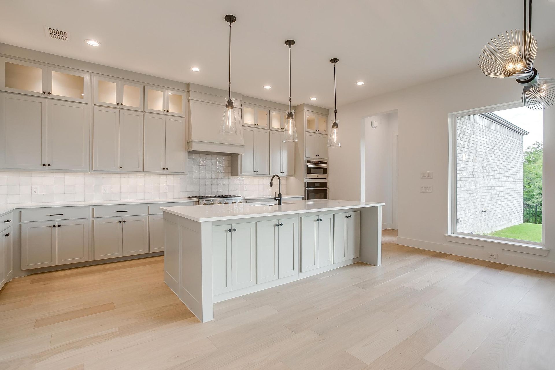 There is a large island in the middle of the kitchen.