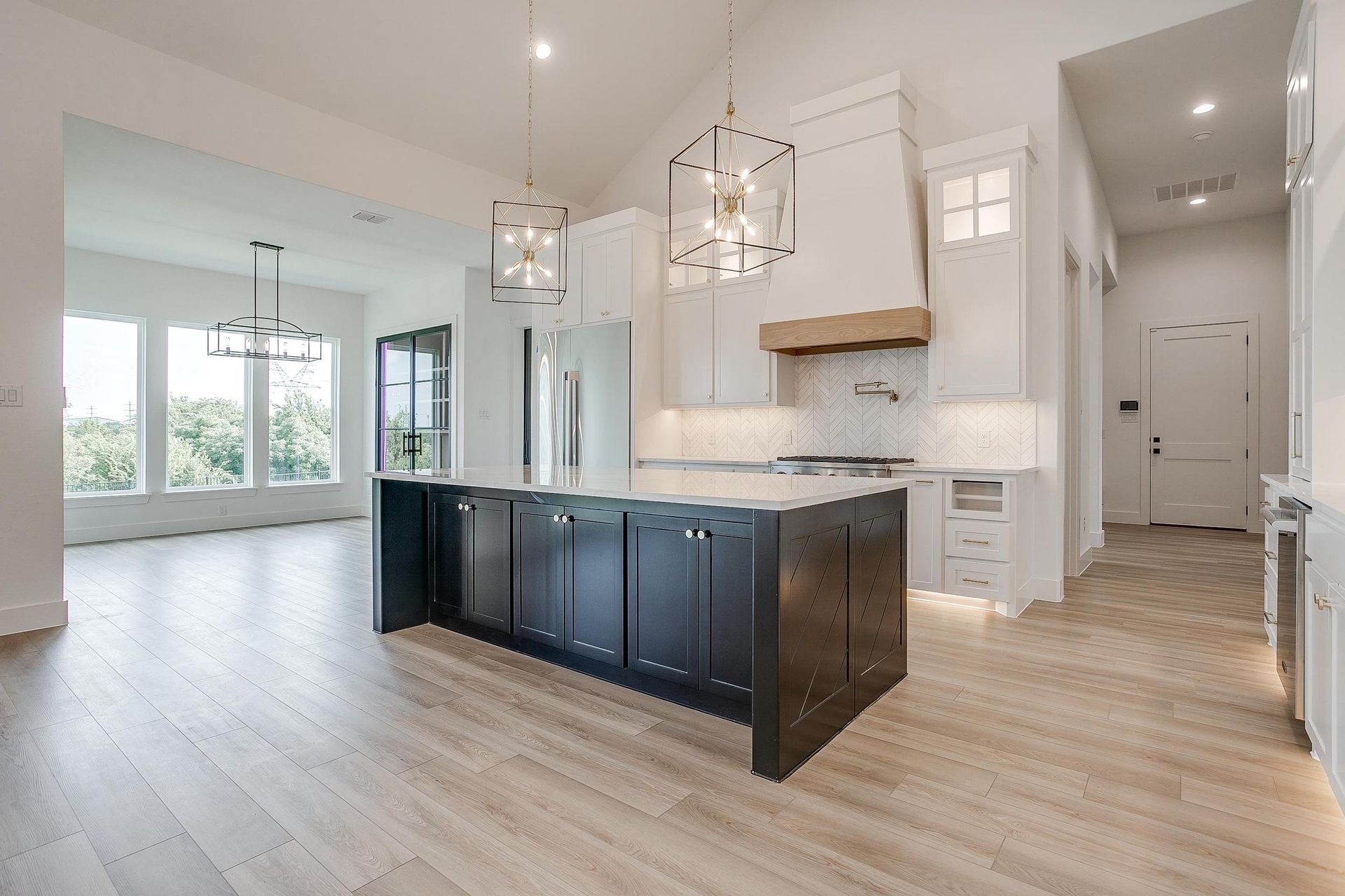 There is a large island in the middle of the kitchen.