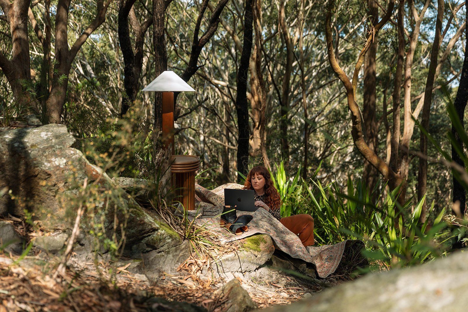 Person Relaxing On A Deck Chair In A Wooded Forest — Everyday Interiors in Helensburgh, NSW