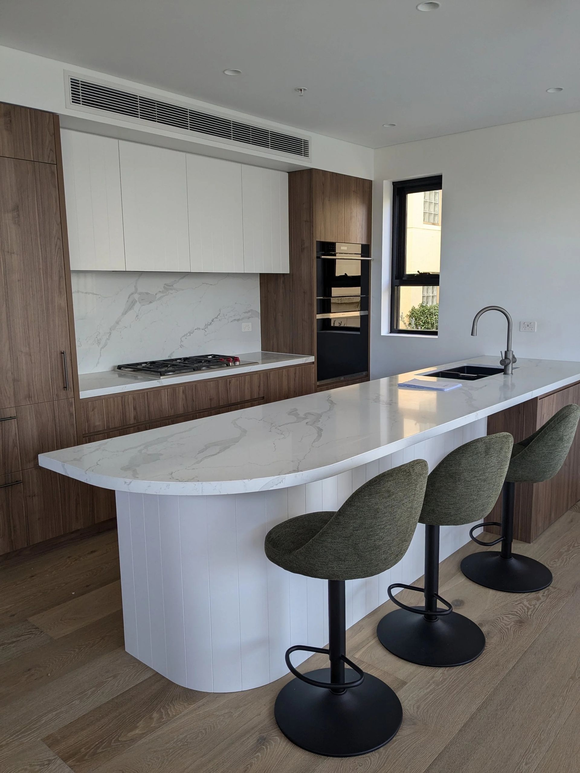Modern Kitchen With White Marble Island, Dark Wood Accents — Everyday Interiors in Helensburgh, NSW