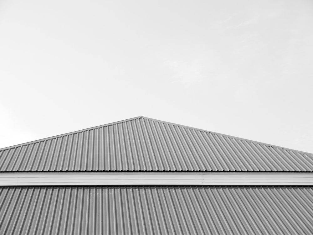 A Black And White Photo Of A Roof With A White Sky In The Background — Premier Roofing Solutions In Lismore, NSW