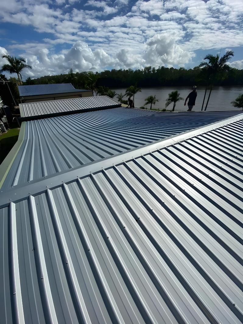 A Close Up Of A Metal Roof With A River In The Background — Premier Roofing Solutions In Lennox Head, NSW