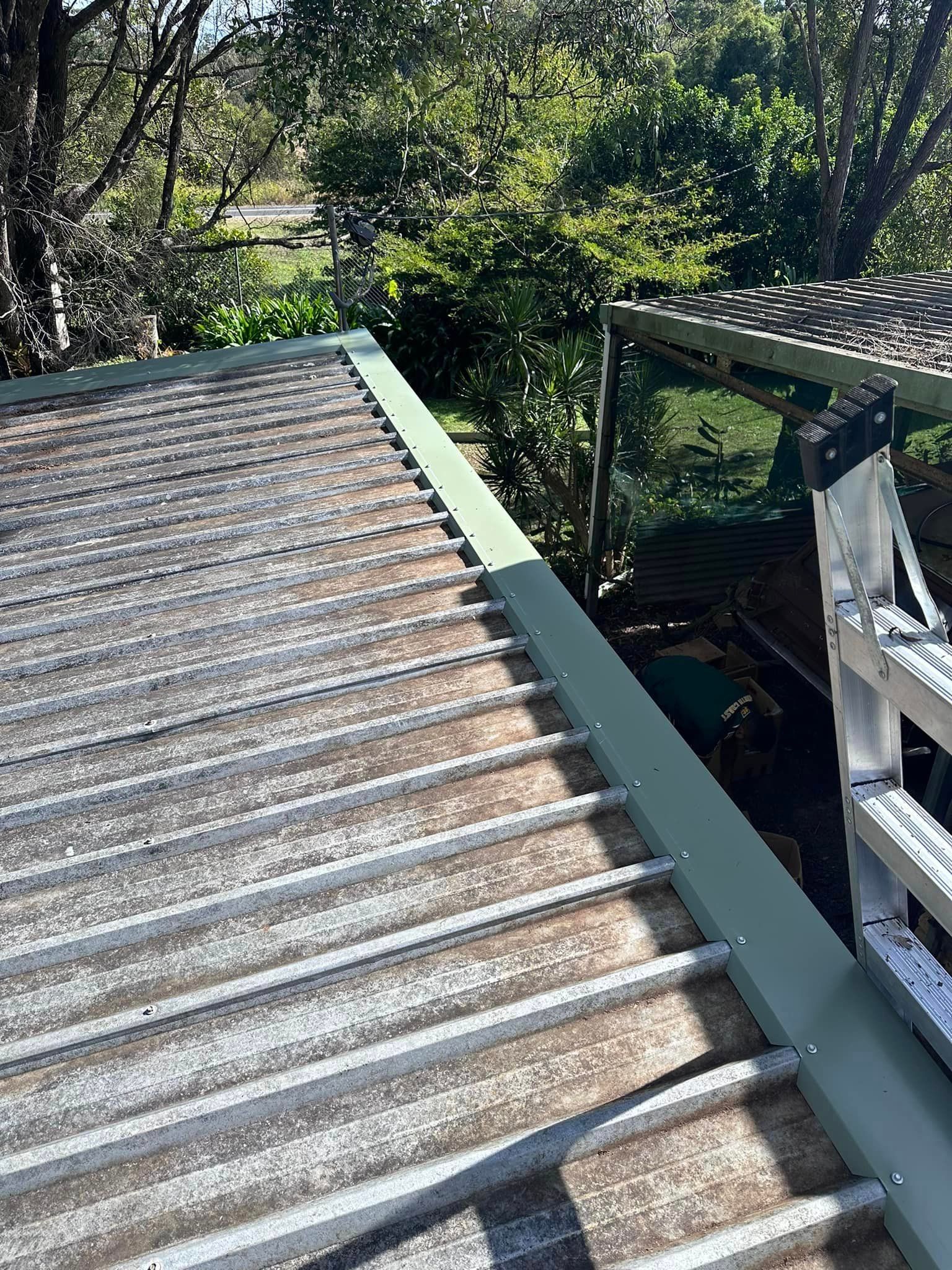 A Close Up Of A Roof With Trees In The Background — Premier Roofing Solutions In Lennox Head, NSW