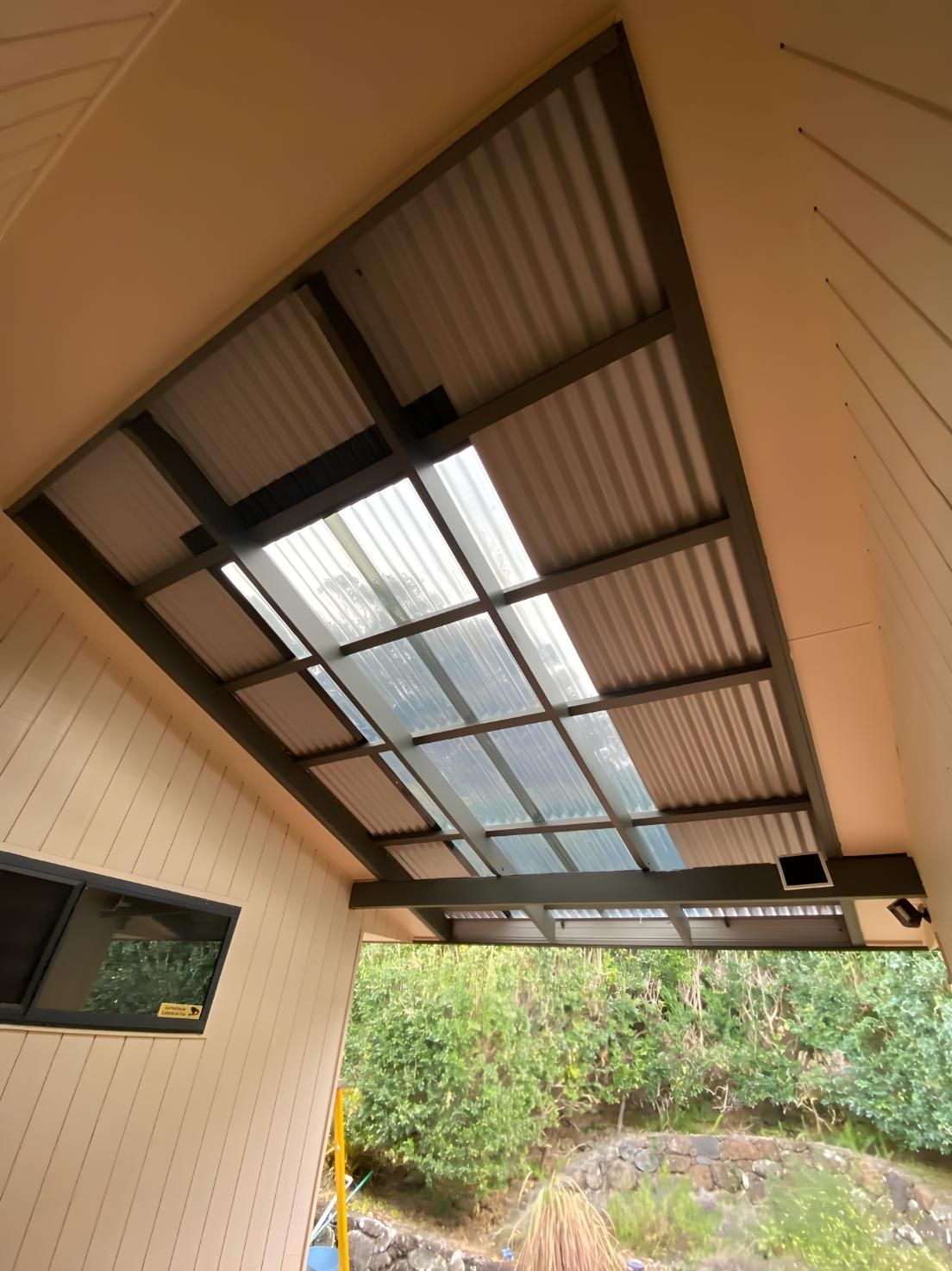 A Roof With A Lot Of Windows And Trees In The Background — Premier Roofing Solutions In Lennox Head, NSW