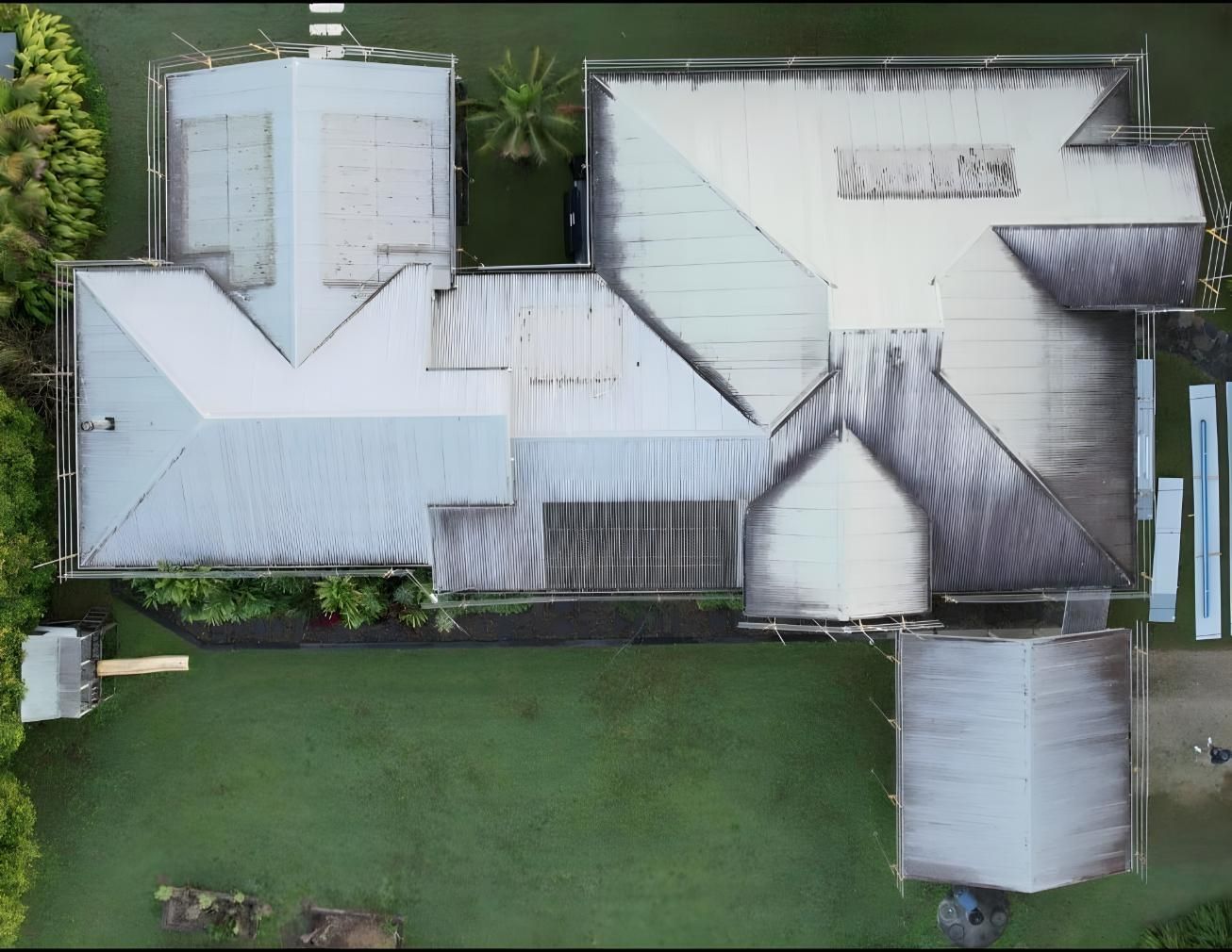 An Aerial View Of A Large House With A White Roof — Premier Roofing Solutions In Lennox Head, NSW