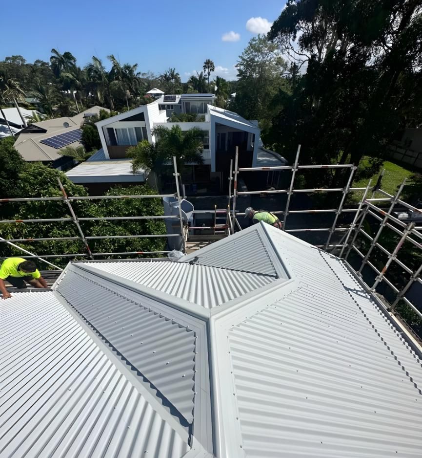Metal Sheet Roof with Blue Sky in The Background — Premier Roofing Solutions In Yamba, NSW