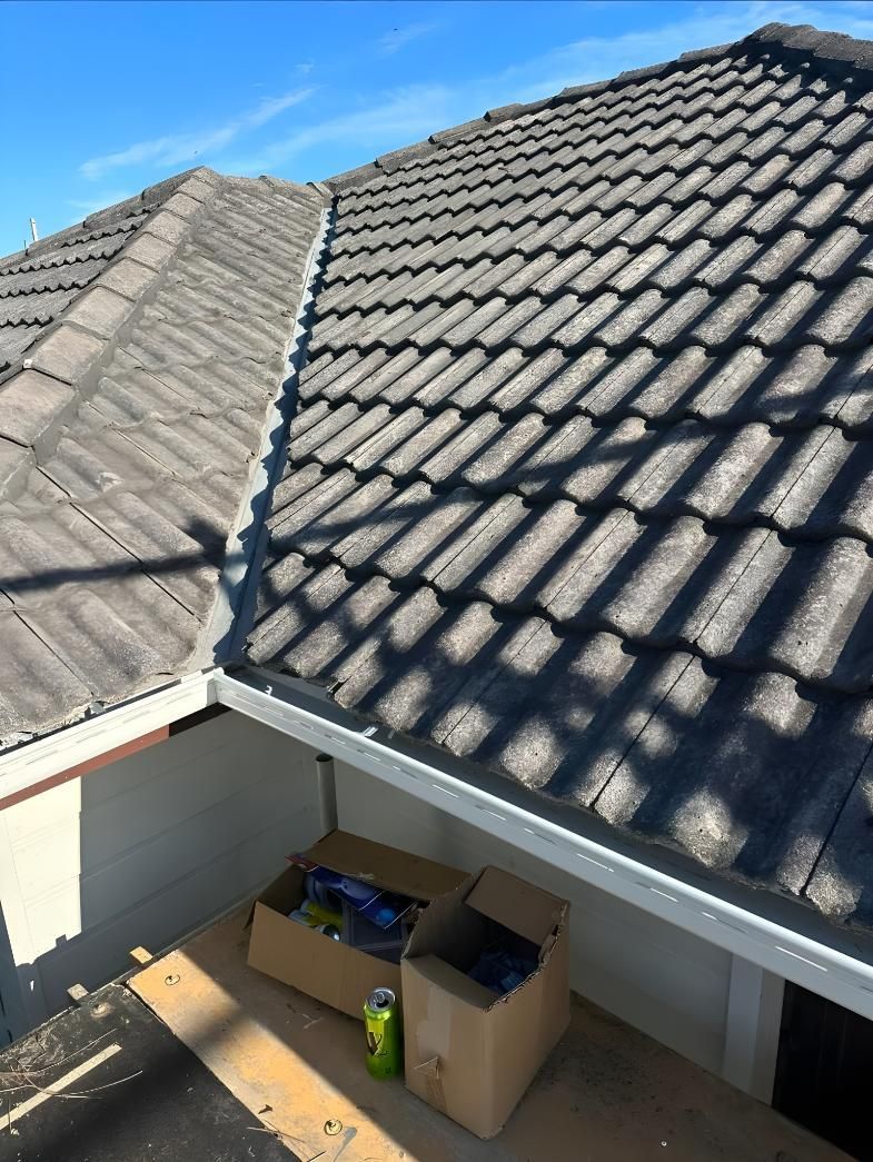 A Roof Of A House With A Box On The Ground Underneath It — Premier Roofing Solutions In Yamba, NSW