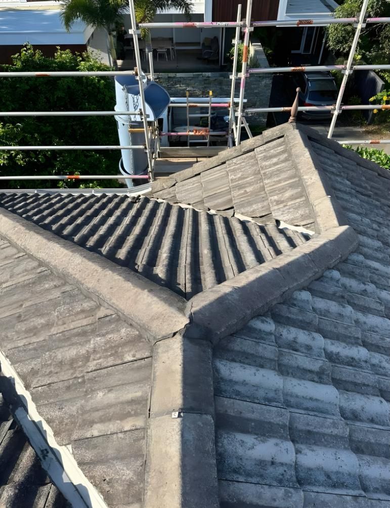 A Close Up Of A Roof With Scaffolding On It — Premier Roofing Solutions In Kyogle, NSW