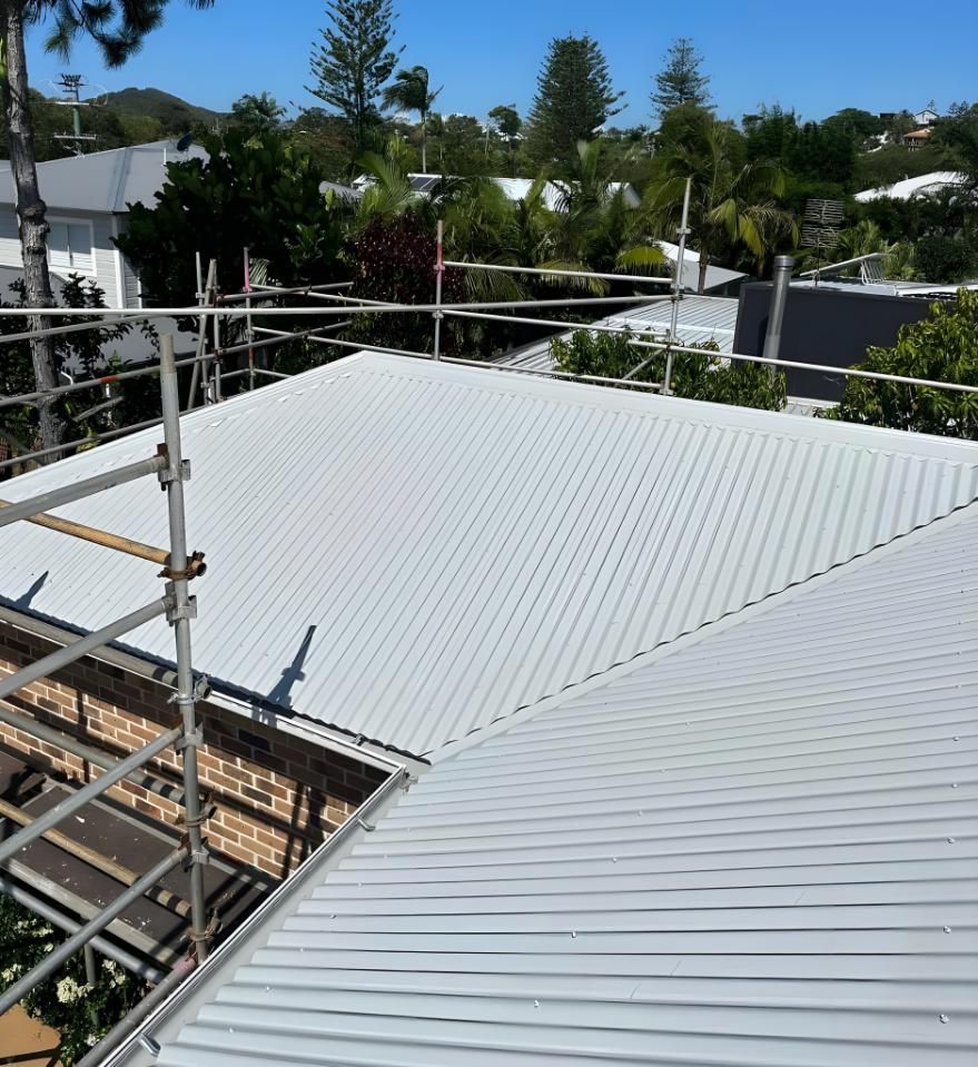 A White Roof With Scaffolding On Top Of It — Premier Roofing Solutions In Kingscliff, NSW