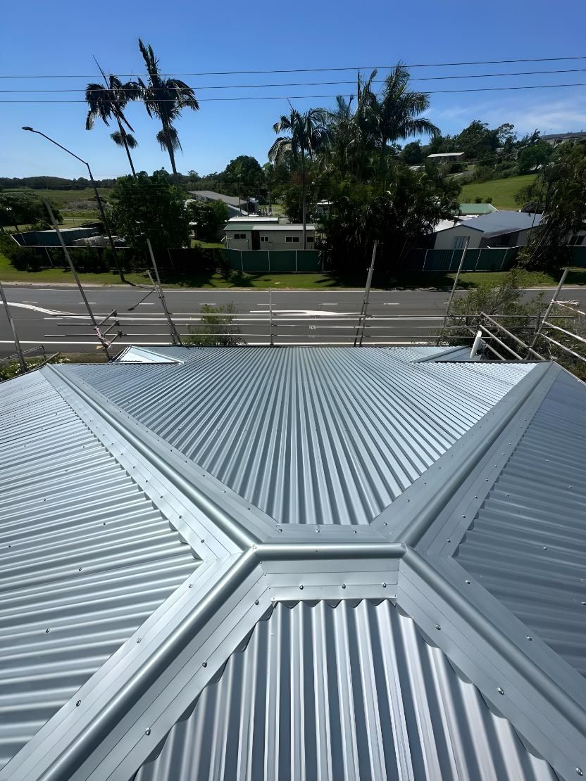 The Roof Of A House With A Palm Tree In The Background — Premier Roofing Solutions In Lennox Head, NSW