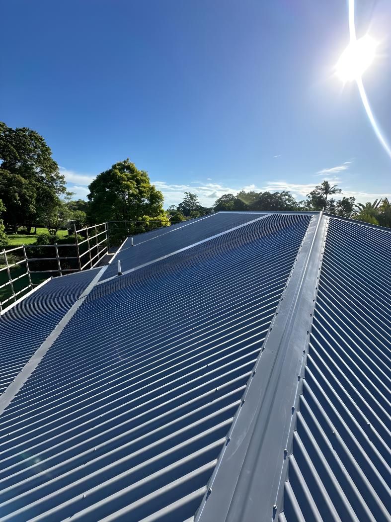 The Sun Is Shining Brightly On The Roof Of A Building — Premier Roofing Solutions In Lennox Head, NSW